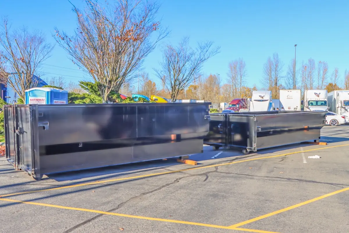 Professional dumpster rental service with roll-off container on residential driveway in Seminole